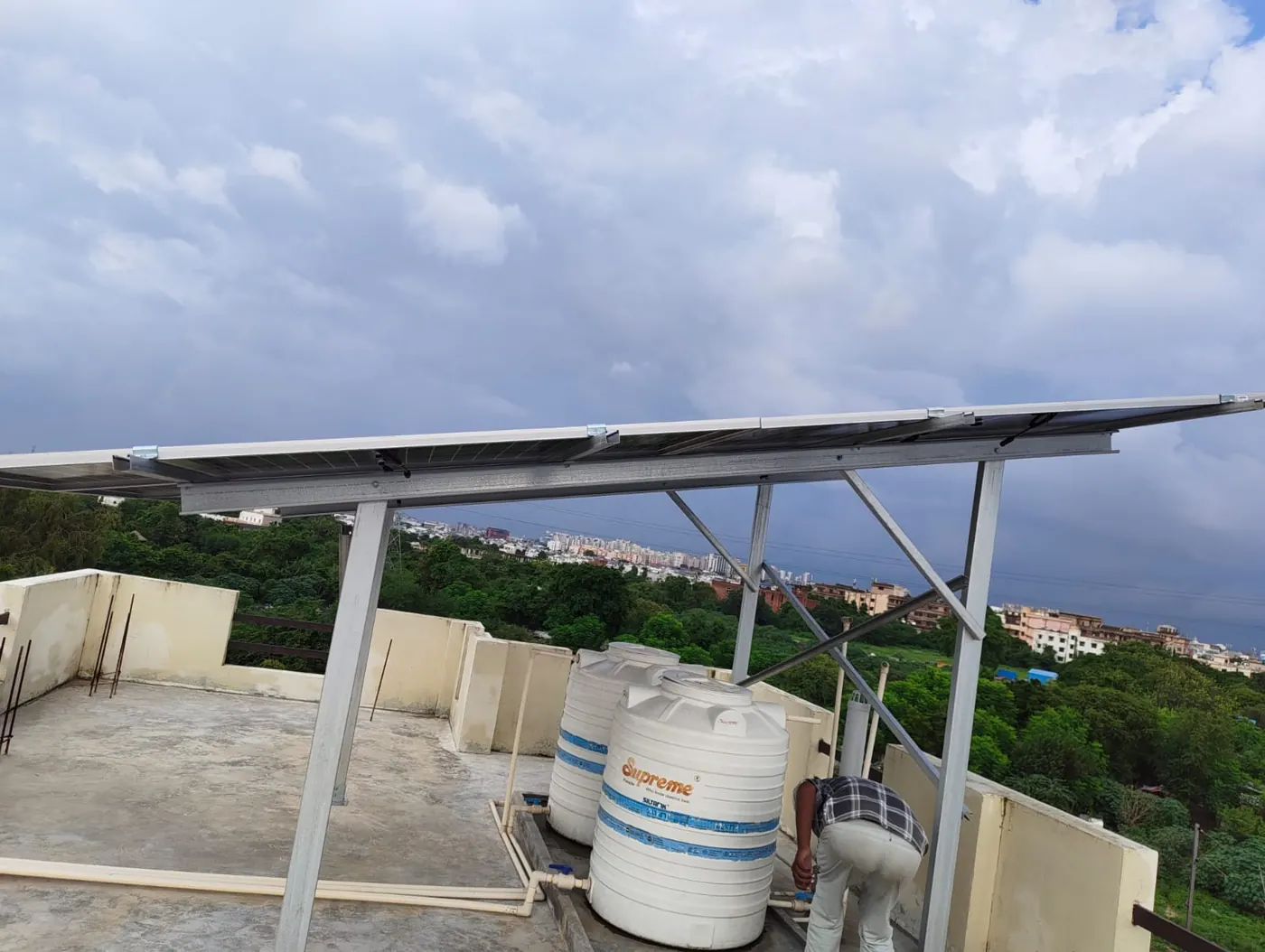Solar structure built over rooftop water tanks